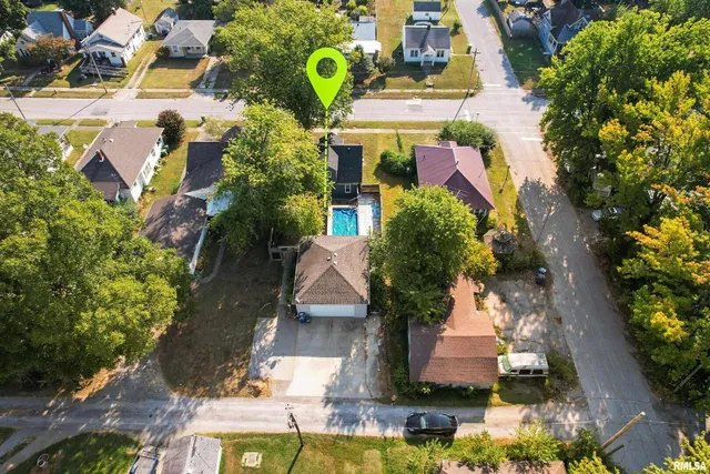 an aerial view of multiple houses with yard