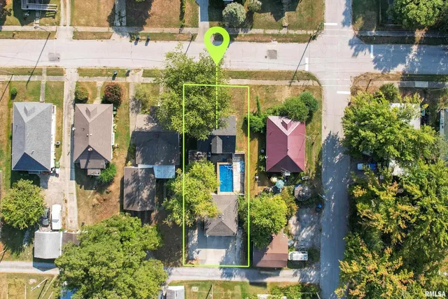 an aerial view of houses with yard