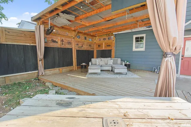 a view of a two chairs in the patio
