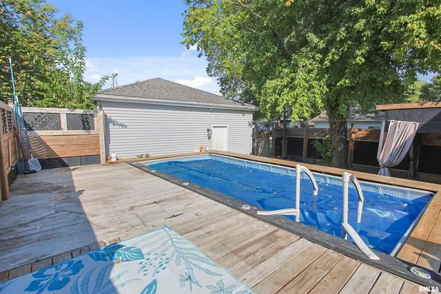 a view of backyard with deck and wooden floor