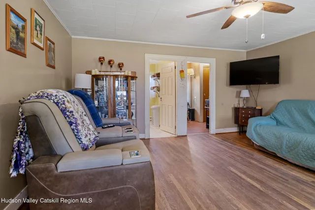 a living room with furniture and a window