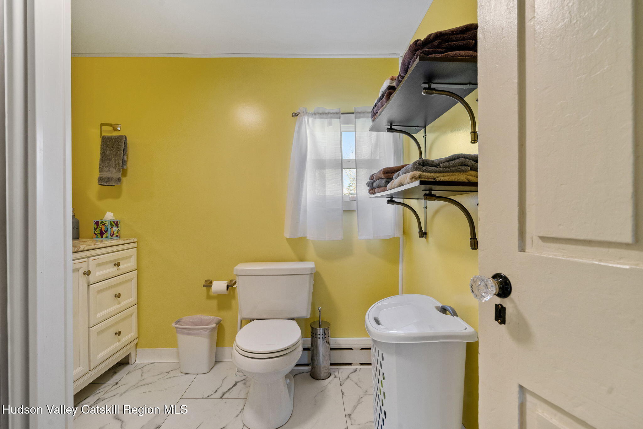 295 County Rte 403 Greenville, NY 12083 - Photo 16 of 65 a bathroom with a toilet mirror vanity and toilet