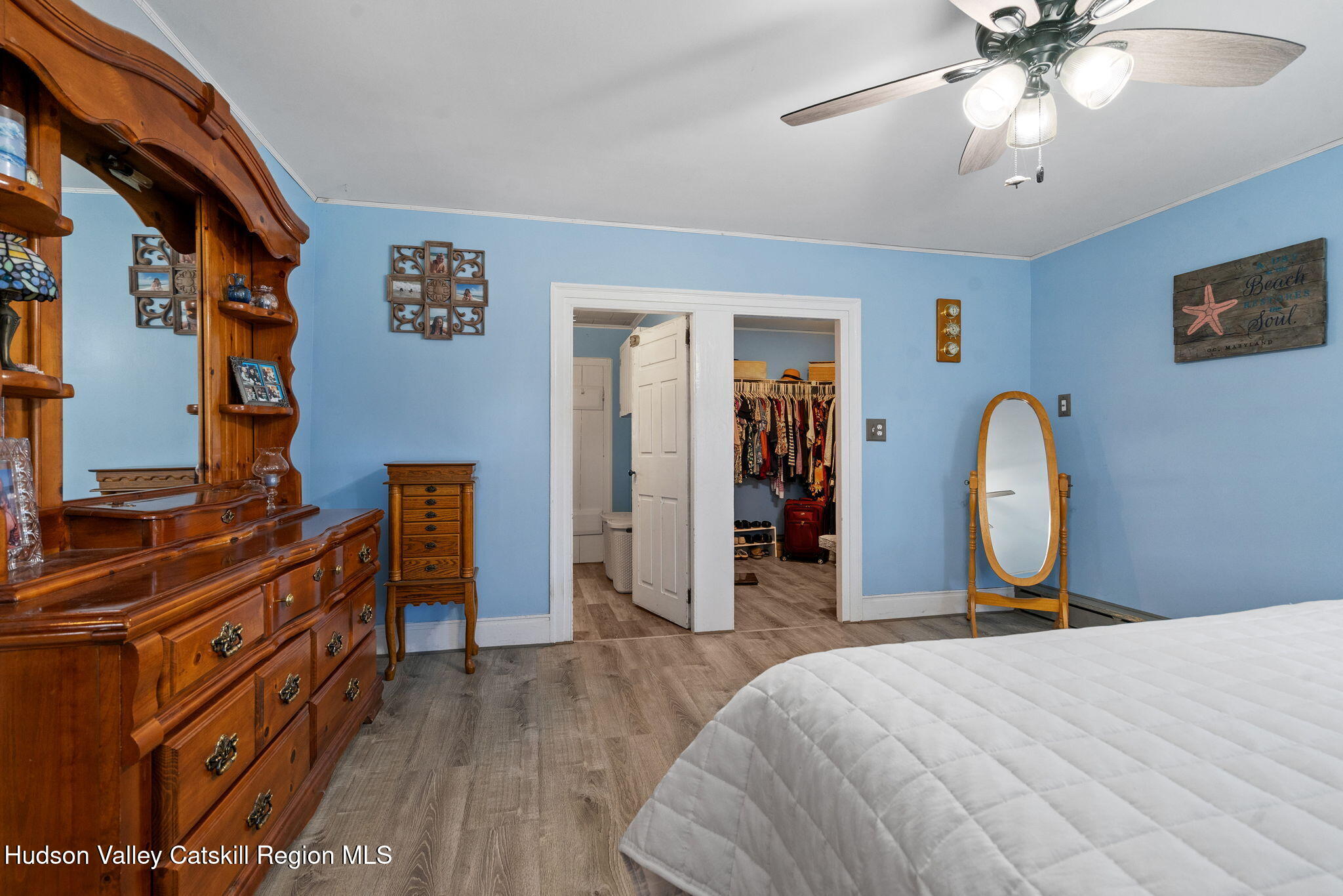 295 County Rte 403 Greenville, NY 12083 - Photo 22 of 65 a bed room with a bed and a chandelier