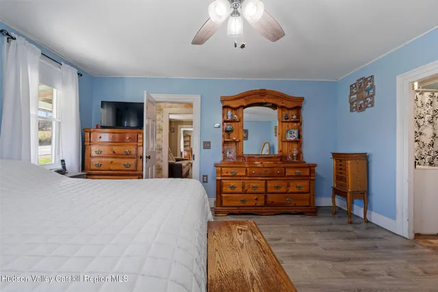 a bed room with bed and window