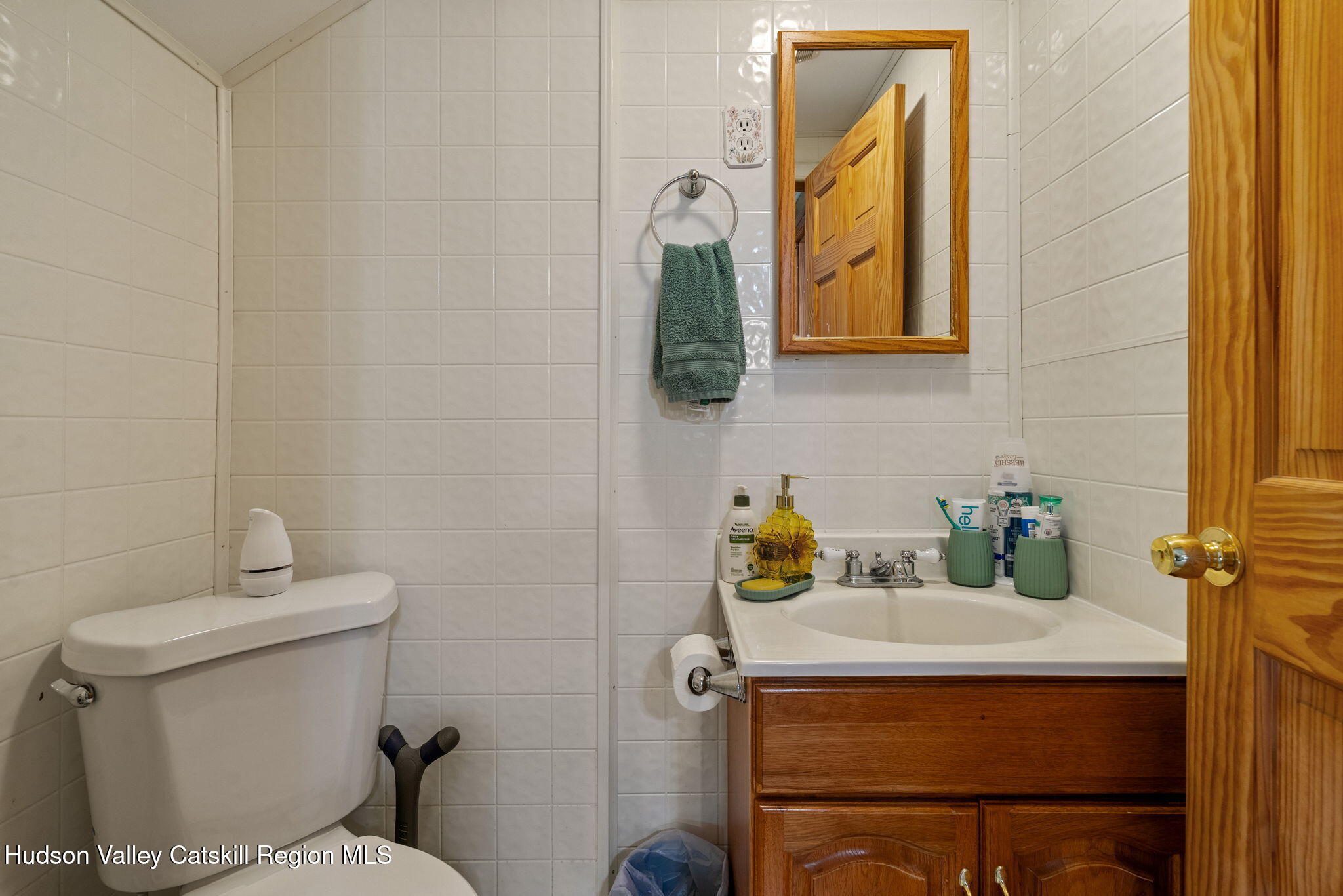 295 County Rte 403 Greenville, NY 12083 - Photo 30 of 65 a bathroom with a toilet sink and mirror