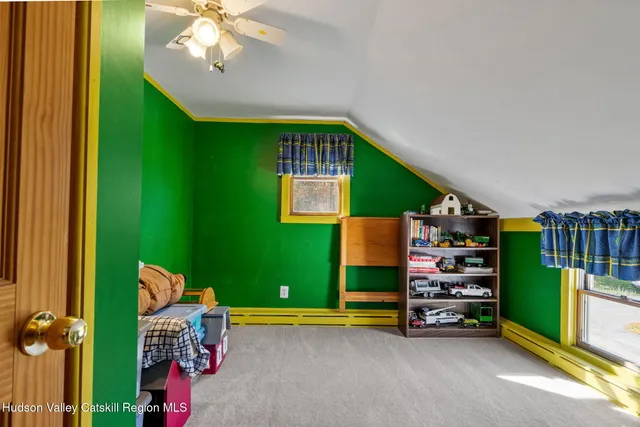 a view of room with window and furniture