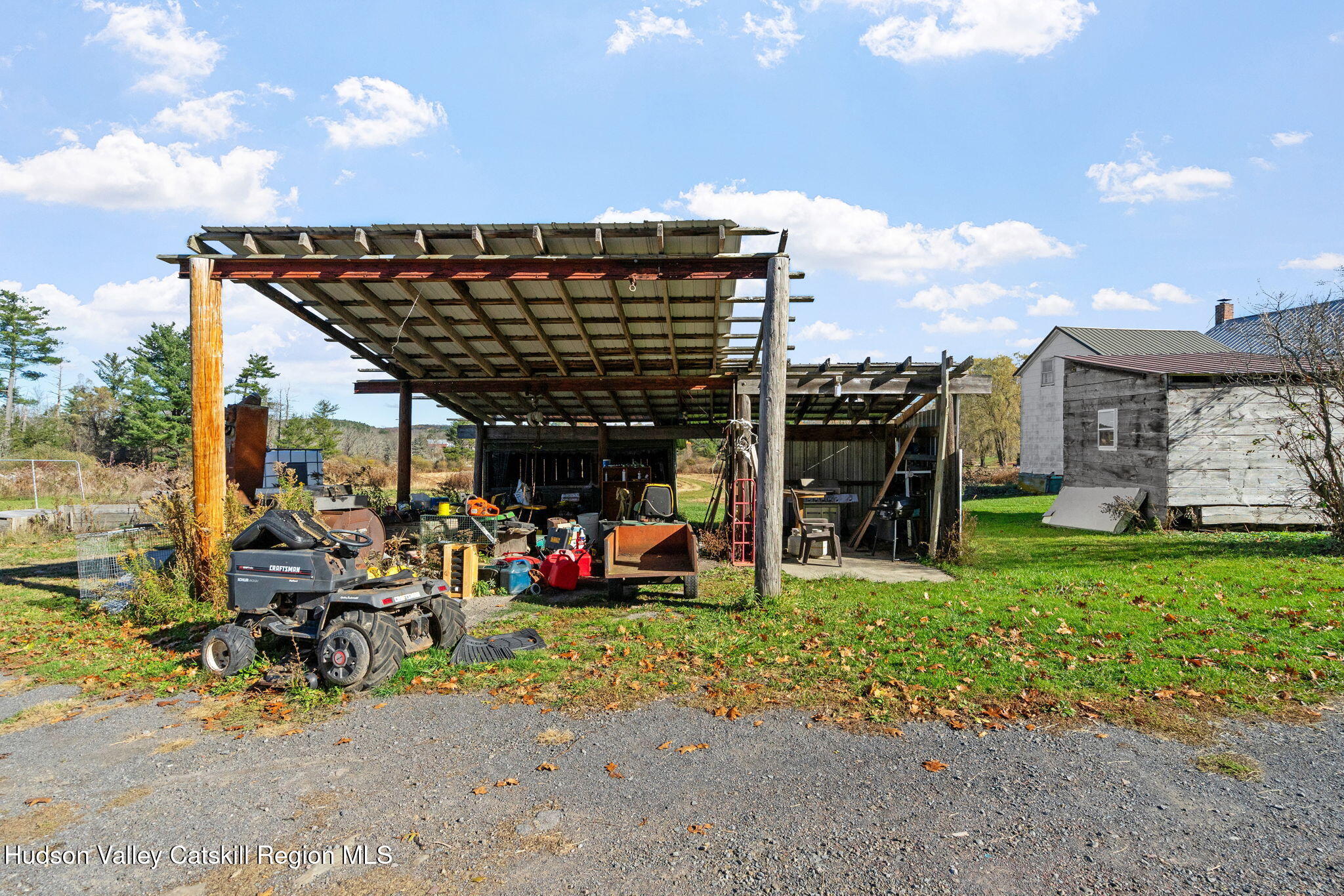 295 County Rte 403 Greenville, NY 12083 - Photo 56 of 65 a view of a chairs and table in the patio next to a yard