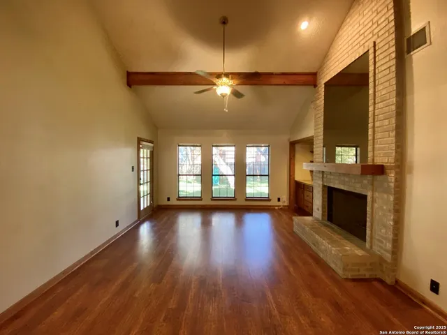 a view of an entryway with wooden floor