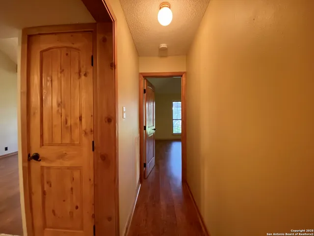 a bathroom with a sink mirror and toilet