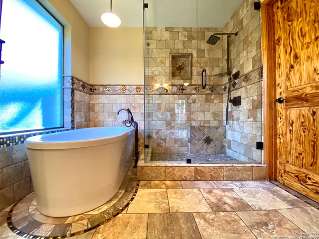 an empty room with closet and a ceiling fan