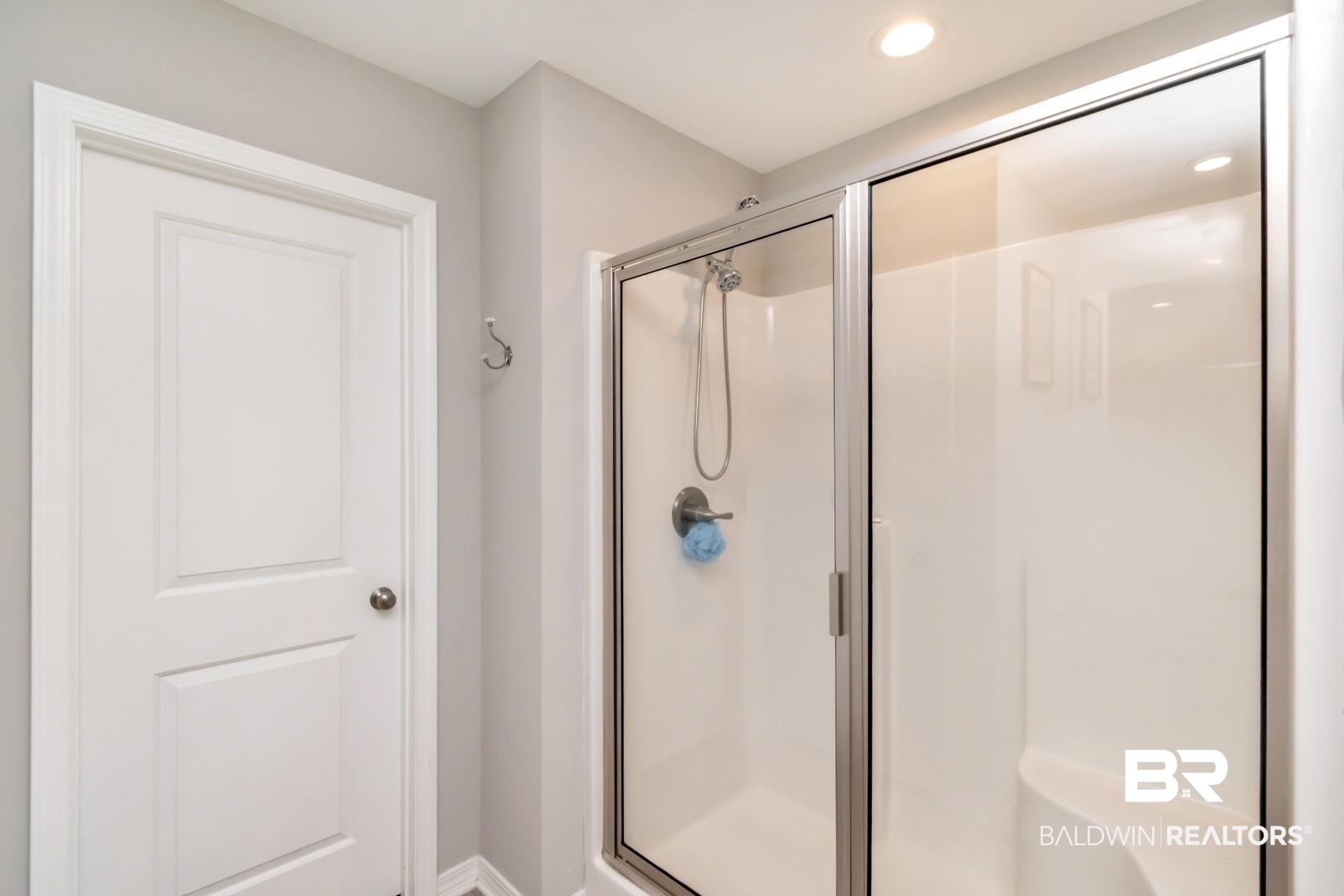 1295 Hayward Loop Foley, AL 36535 - Photo 16 of 29 Walk-in shower with a glass enclosure, built-in bench, and polished chrome shower fixture