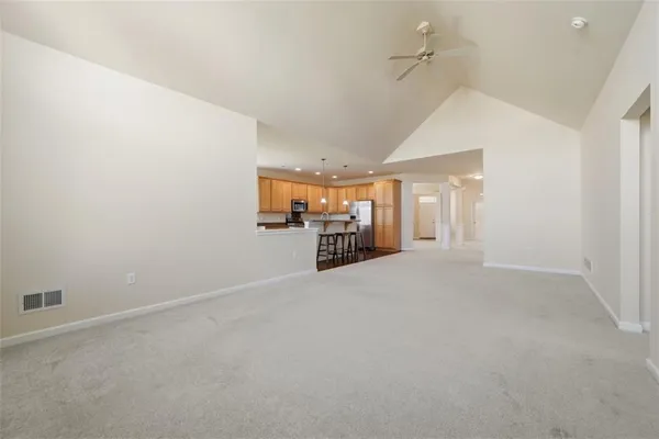 a view of a kitchen with a sink and cabinets
