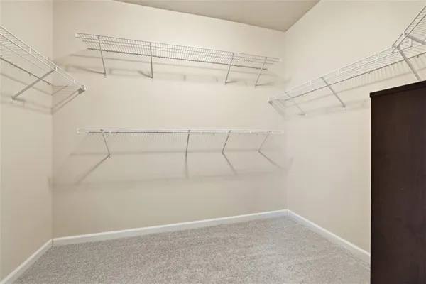 a spacious bathroom with a bathtub and toilet