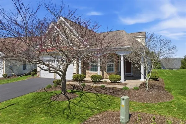 a view of a house with backyard porch and sitting area