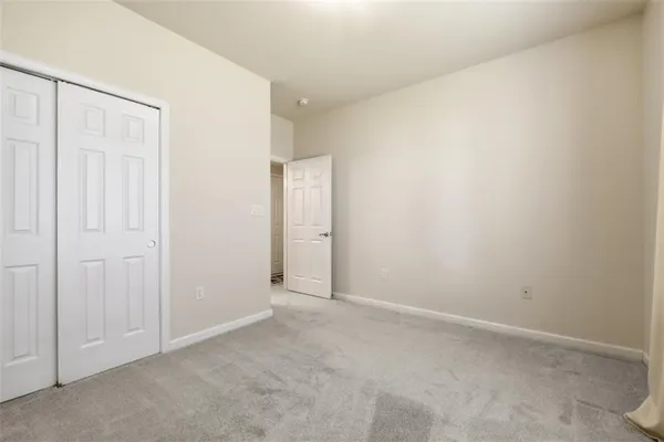 a bathroom with a sink a toilet and shower curtain