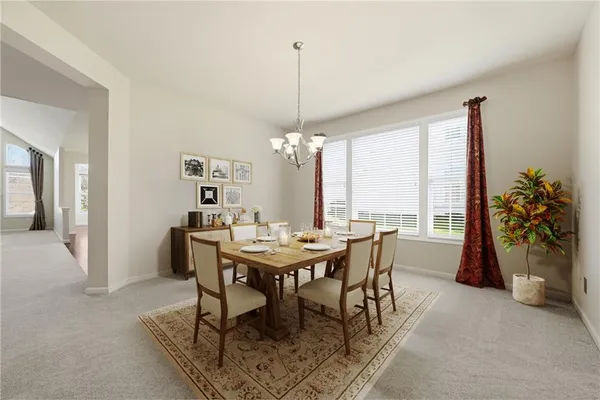 a view of a chandelier in big room and chandelier fan