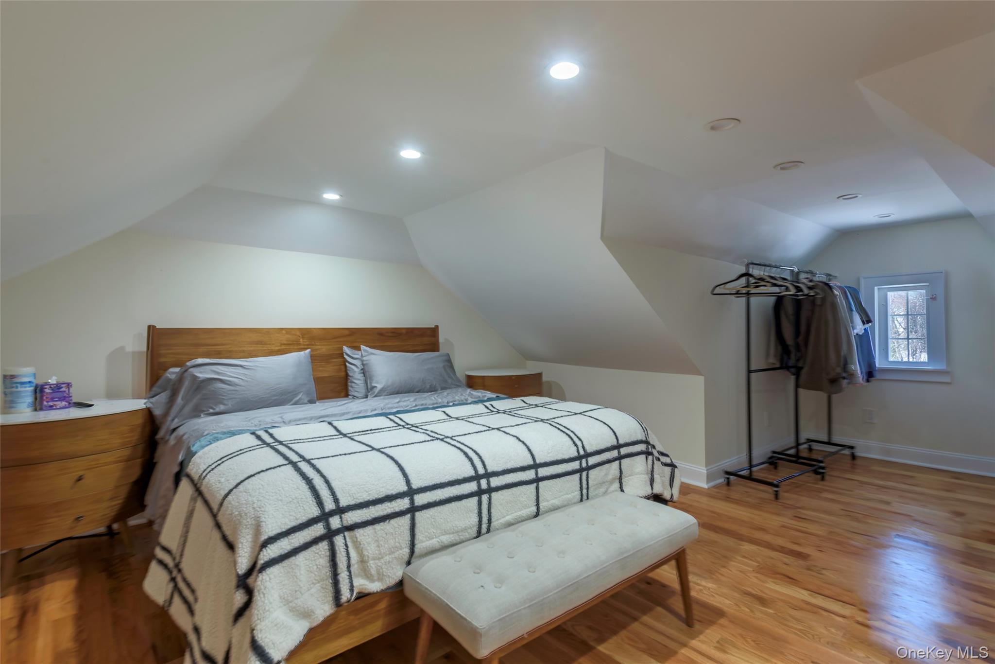 20 North Ravine Road Great Neck, NY 11023 - Photo 17 of 27 a bedroom with a bed and wooden floor