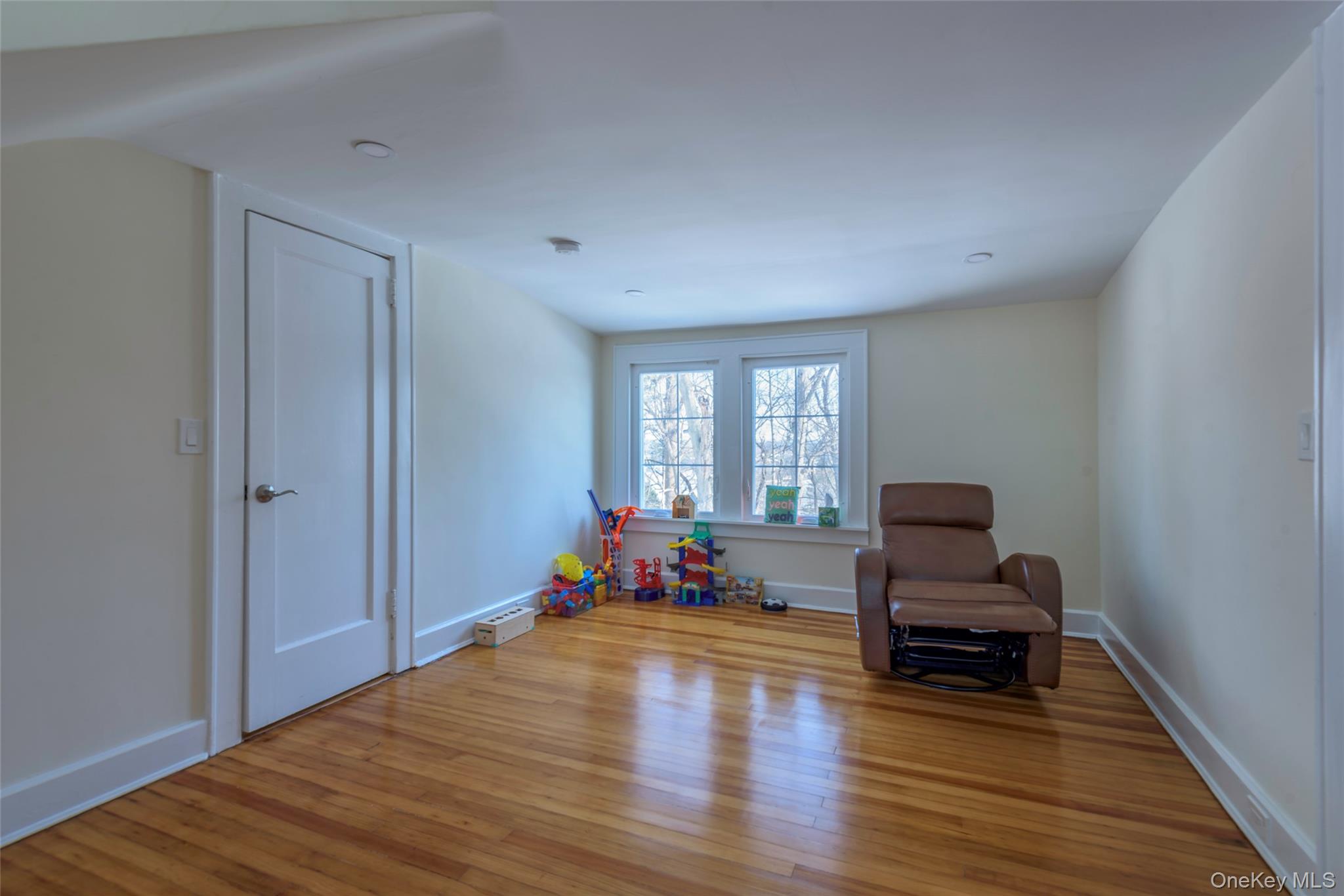 20 North Ravine Road Great Neck, NY 11023 - Photo 22 of 27 a living room with furniture and wooden floor