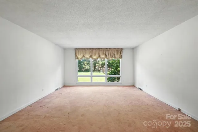 a view of a big room with a large window