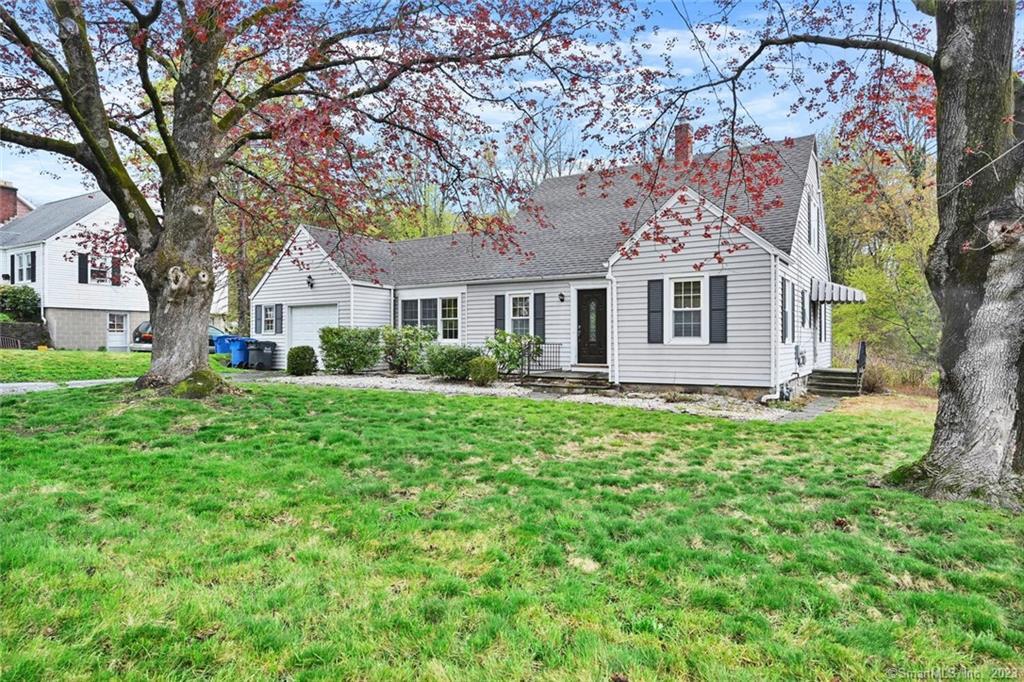 70 Stonehouse Road Trumbull, CT 06611 - Photo 1 of 1 a front view of a house with a garden