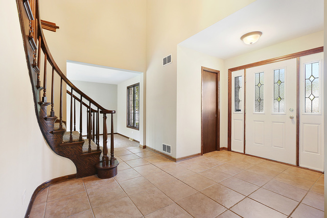 3033 East Hickory Lane Crete, IL 60417 - Photo 2 of 18 a view of entryway with wooden floor and stairs