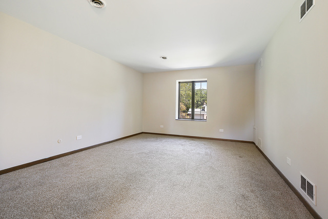 3033 East Hickory Lane Crete, IL 60417 - Photo 11 of 18 an empty room with windows