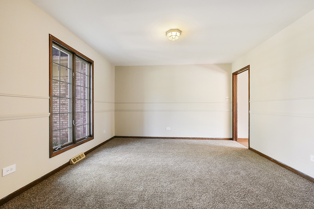 3033 East Hickory Lane Crete, IL 60417 - Photo 9 of 18 an empty room with windows