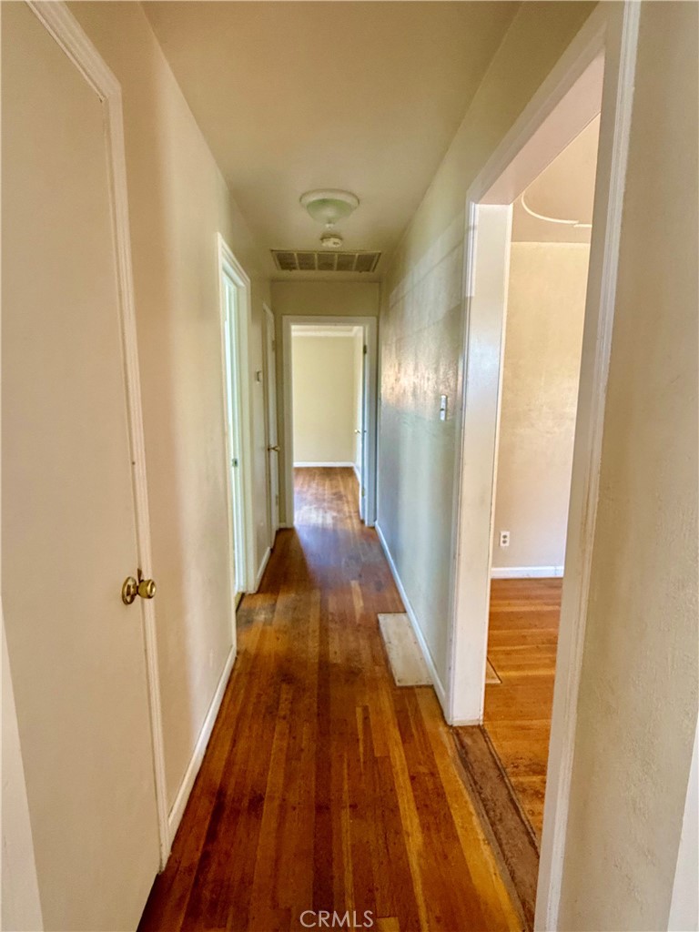 1127 West 23rd Street Merced, CA 95340 - Photo 7 of 23 Hallway with hardwood flooring