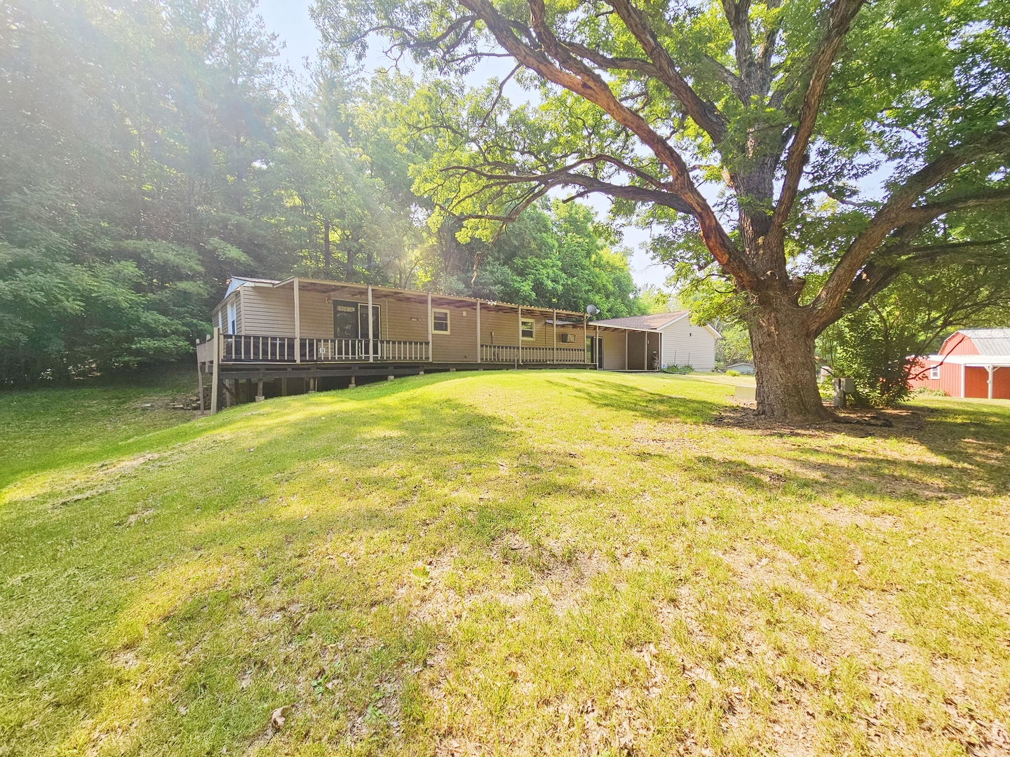 16710 Browns Road Morrison, IL 61270 - Photo 4 of 39 a view of a swimming pool and trees in the background