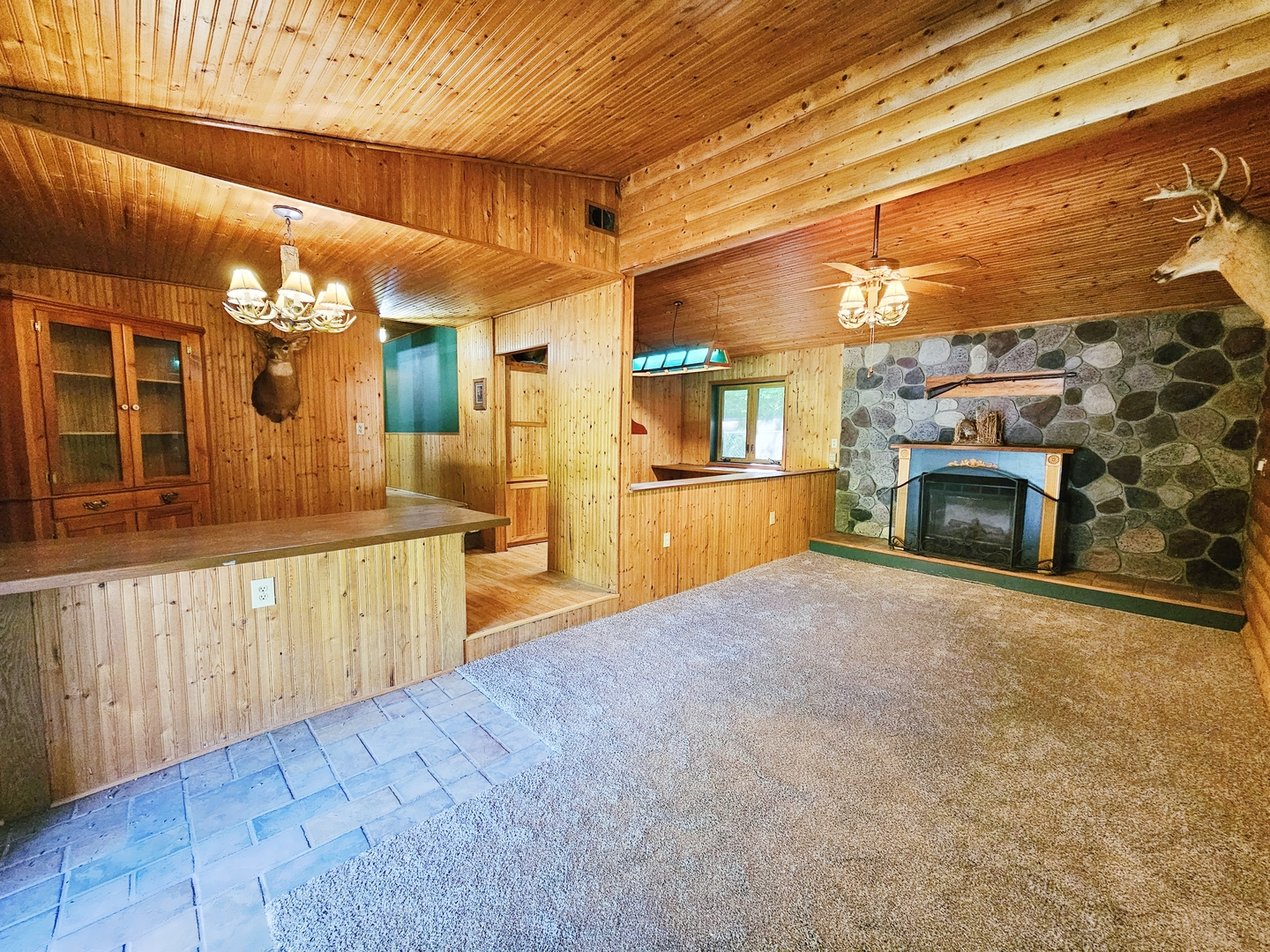 16710 Browns Road Morrison, IL 61270 - Photo 6 of 39 a large kitchen with a lot of cabinets and a wooden floor