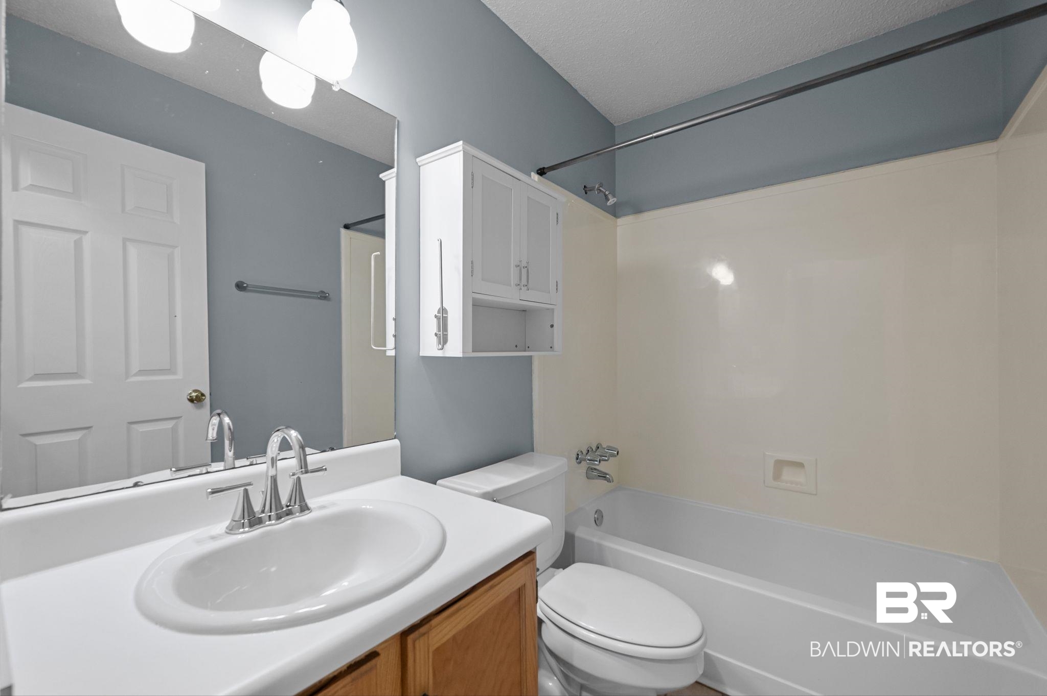 3744 Pepper Ridge Drive Mobile, AL 36693 - Photo 21 of 29 Full bathroom with vanity, washtub / shower combination, and a textured ceiling