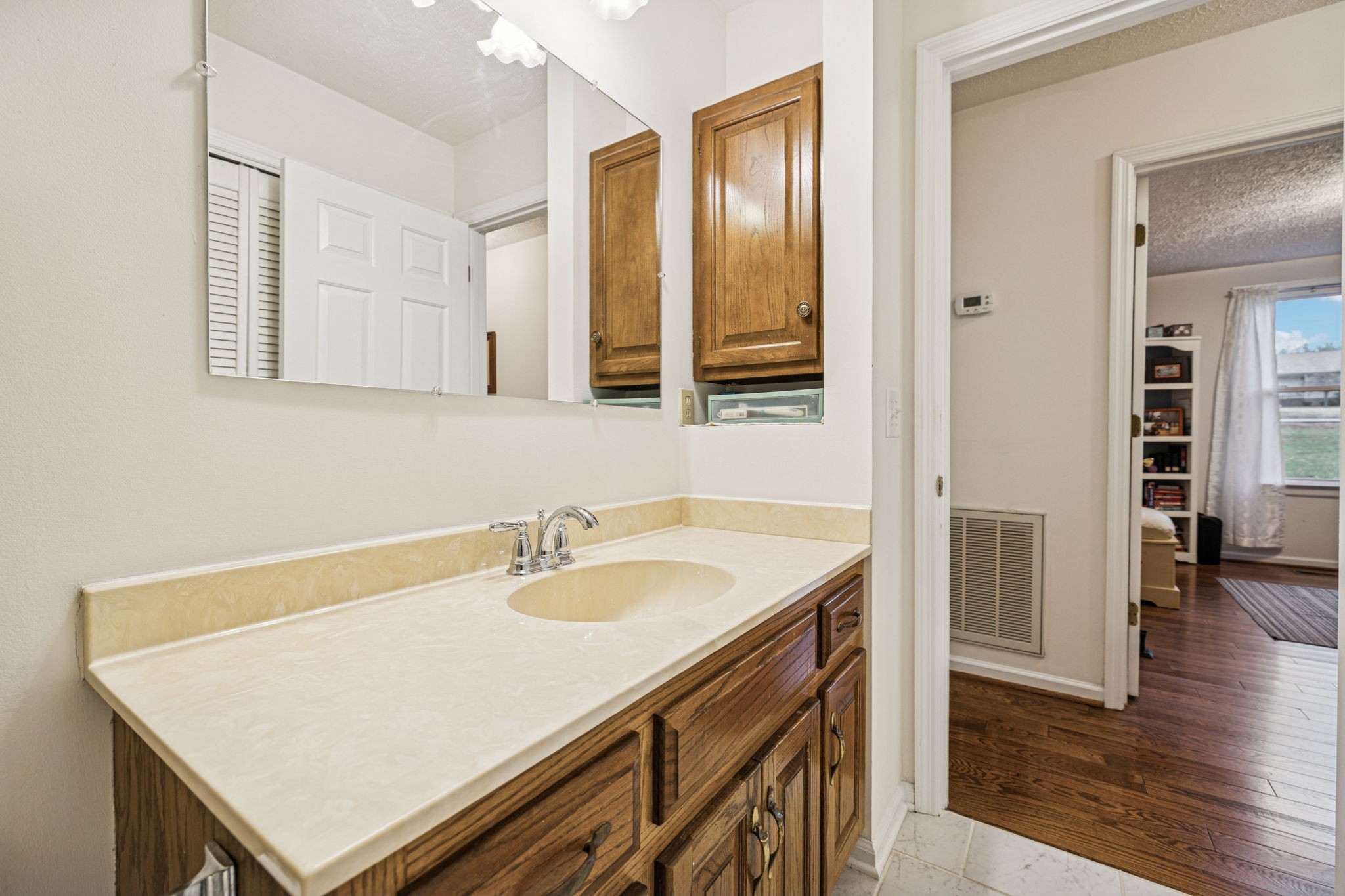 3328 Beckwith Road Mount Juliet, TN 37122 - Photo 12 of 18 a bathroom with a sink a vanity and a mirror