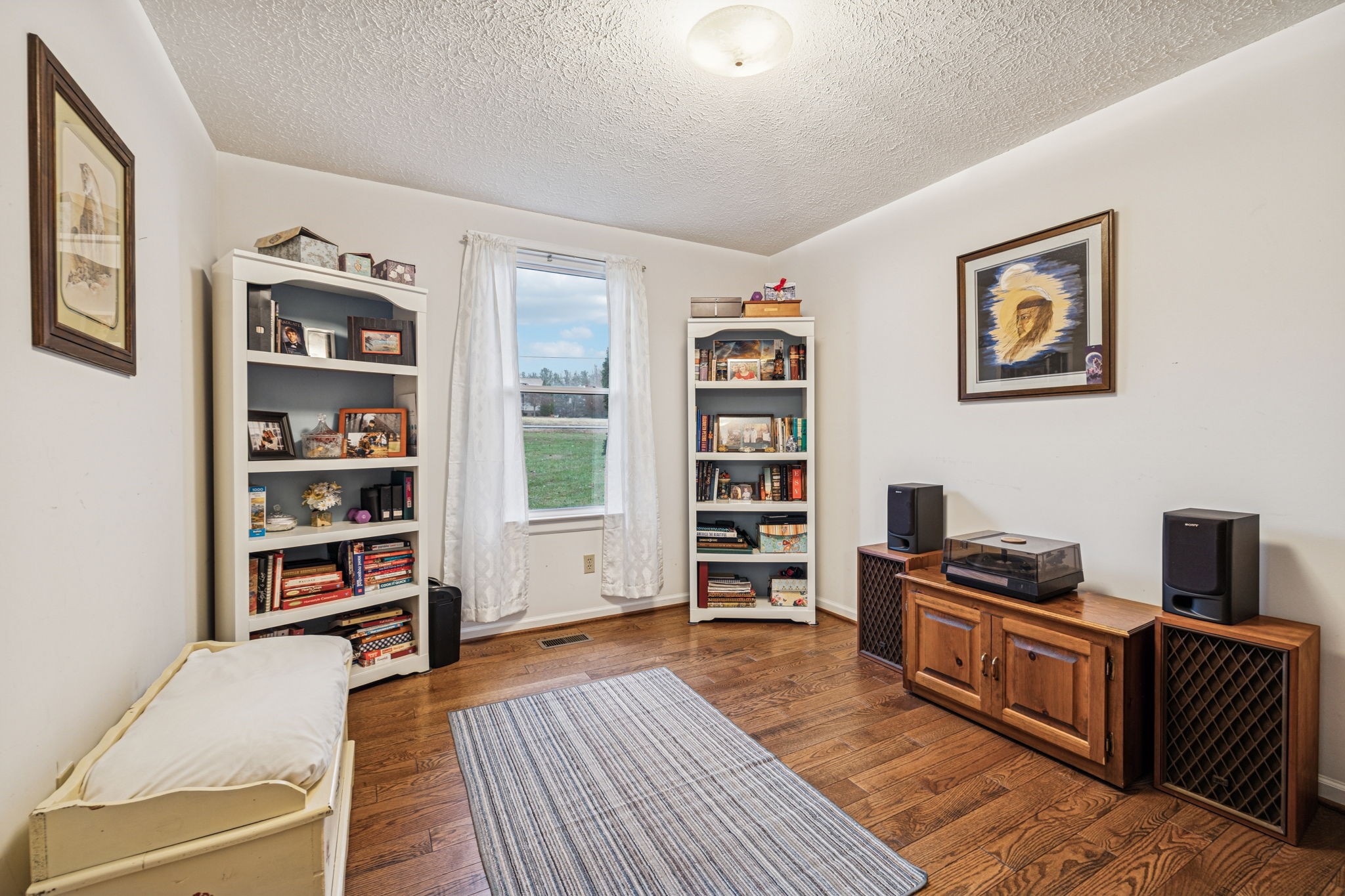 3328 Beckwith Road Mount Juliet, TN 37122 - Photo 13 of 18 a bedroom with furniture and book shelf
