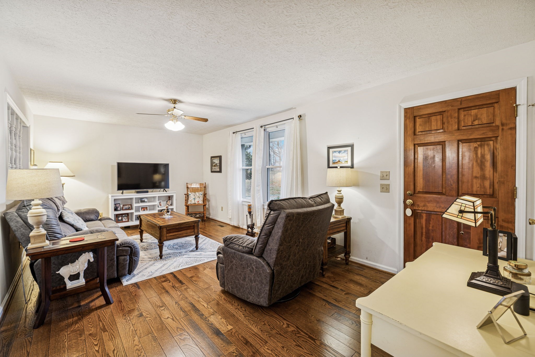 3328 Beckwith Road Mount Juliet, TN 37122 - Photo 3 of 18 a living room with furniture and a flat screen tv