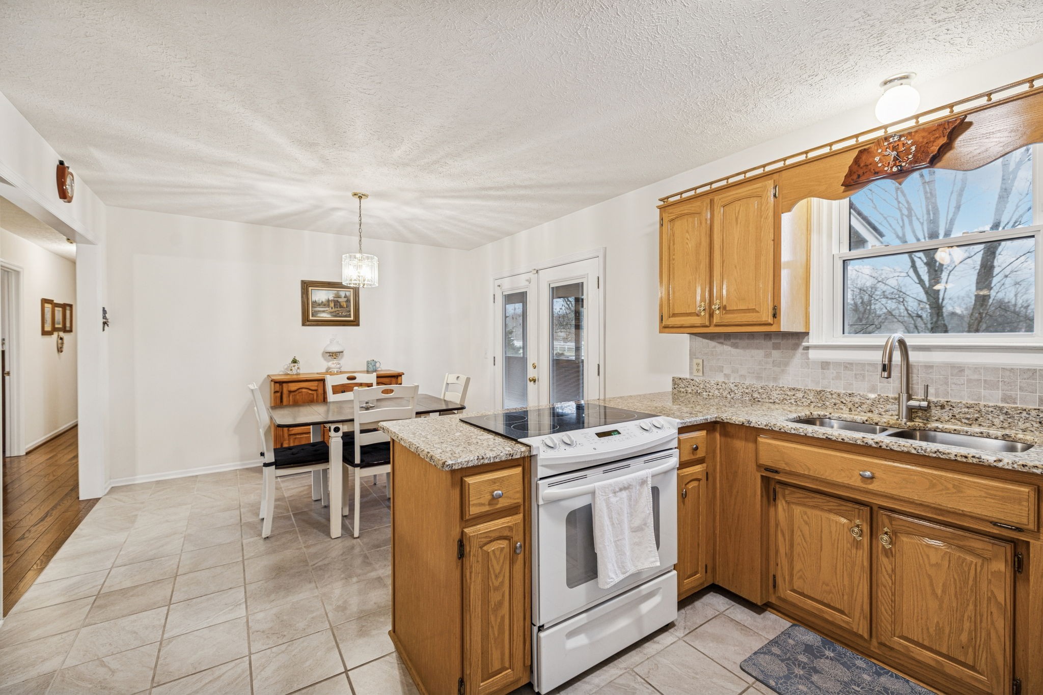 3328 Beckwith Road Mount Juliet, TN 37122 - Photo 7 of 18 a kitchen that has a sink a stove counter top space and cabinets