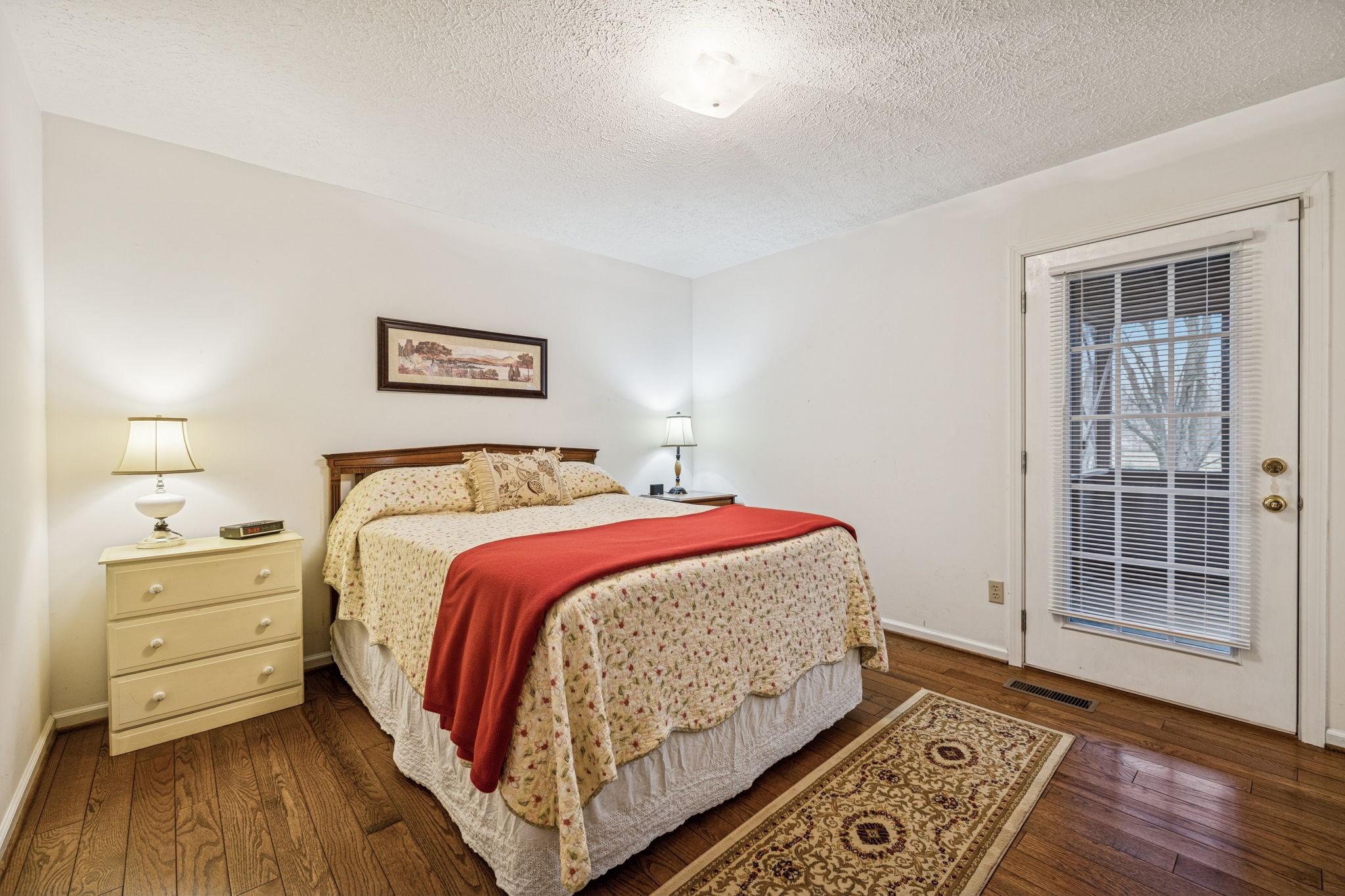 3328 Beckwith Road Mount Juliet, TN 37122 - Photo 8 of 18 a bedroom with a bed and wooden floor