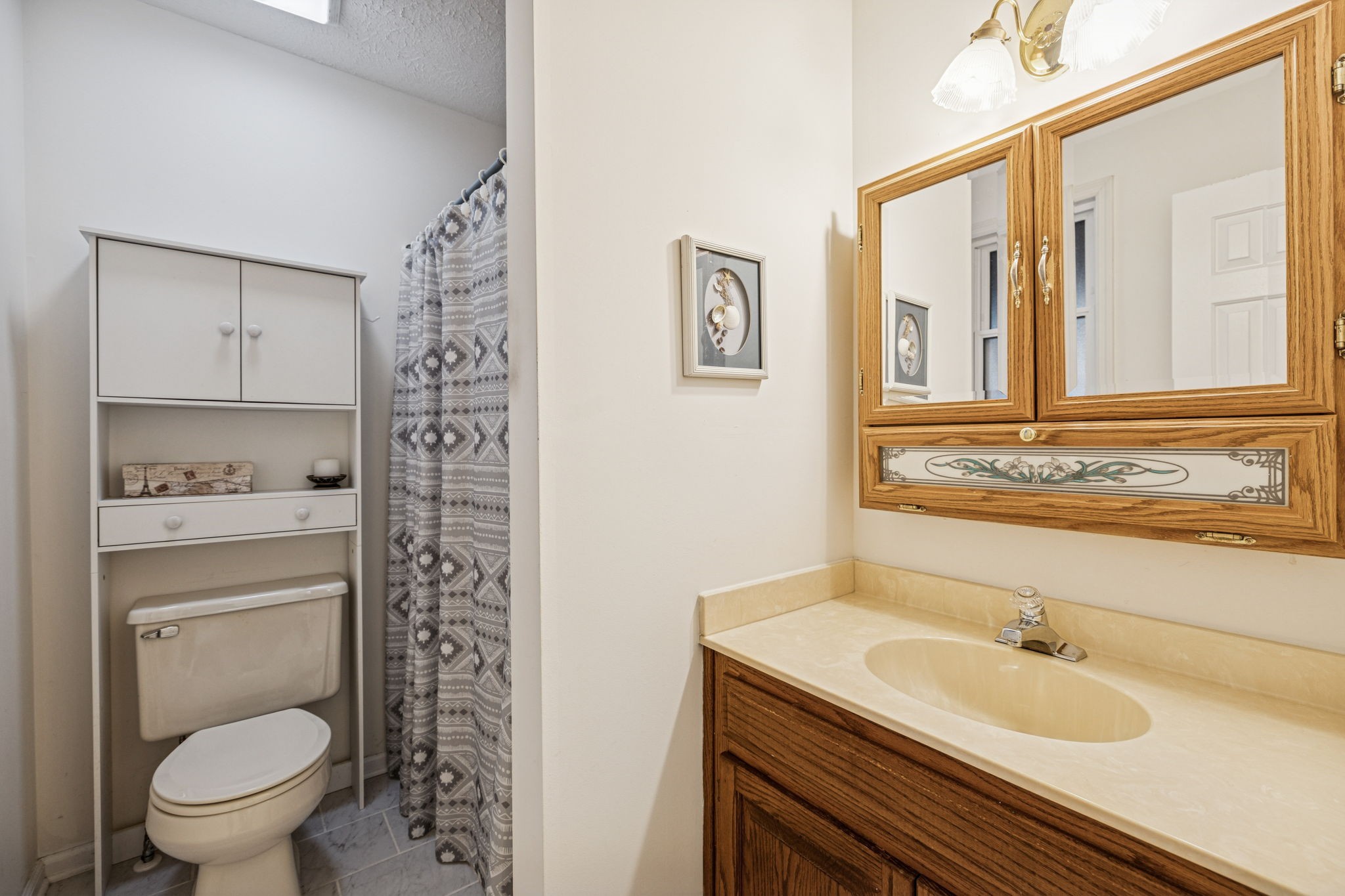 3328 Beckwith Road Mount Juliet, TN 37122 - Photo 9 of 18 a bathroom with a granite countertop sink toilet and shower