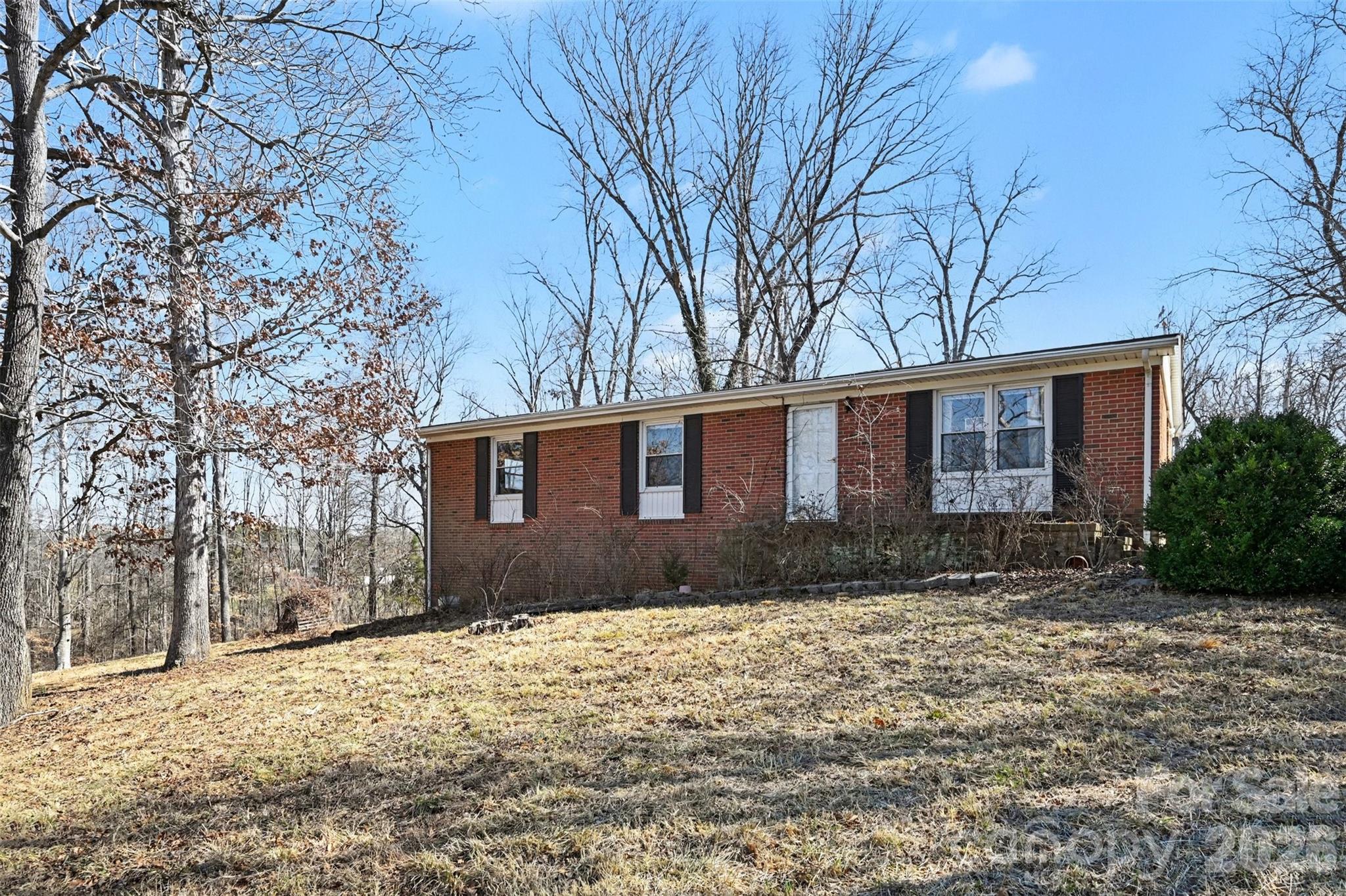 4650 Windy Road Concord, NC 28027 - Photo 1 of 34 a front view of a house with a yard