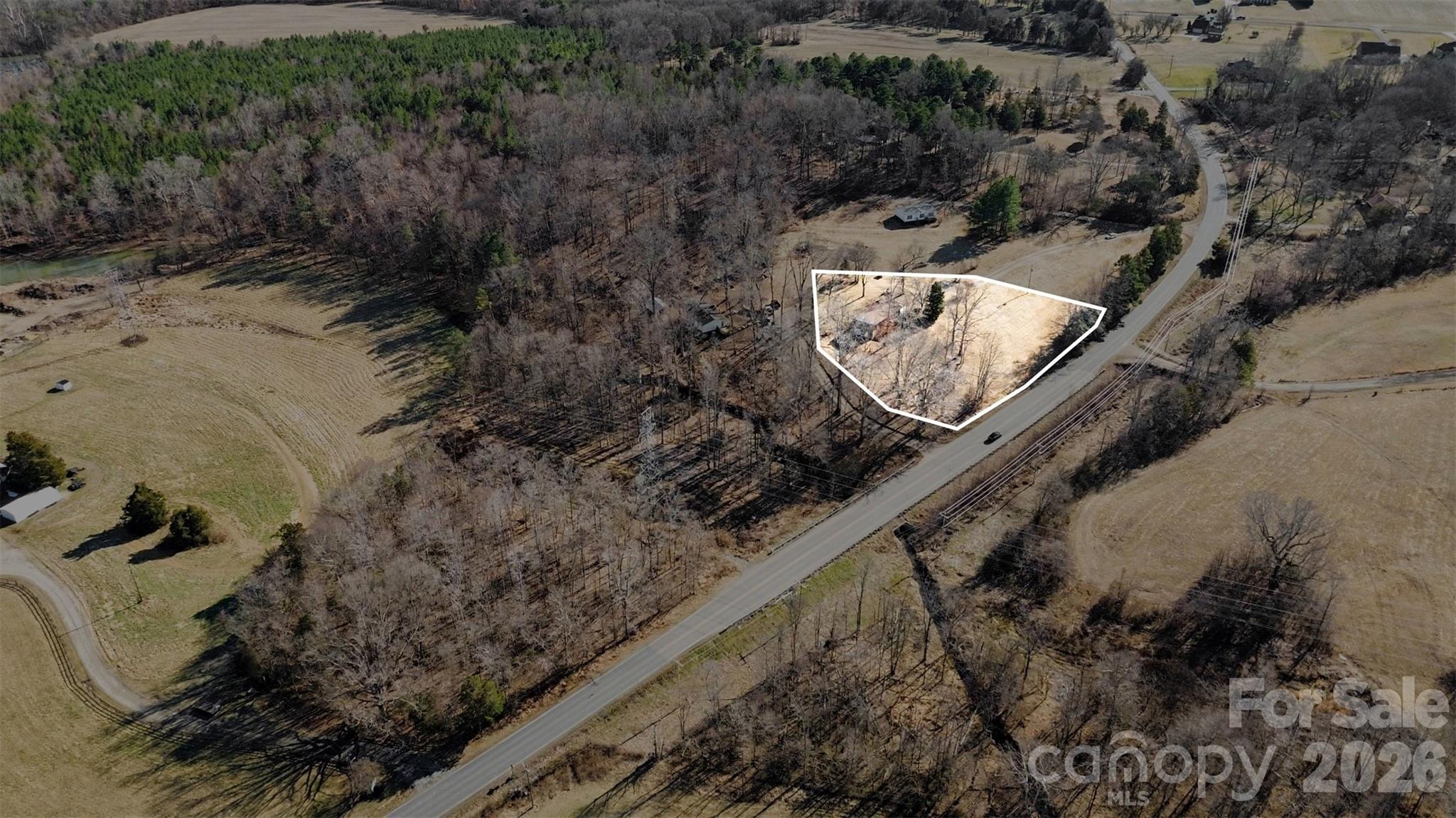4650 Windy Road Concord, NC 28027 - Photo 18 of 34 a bird view of a house next to a yard