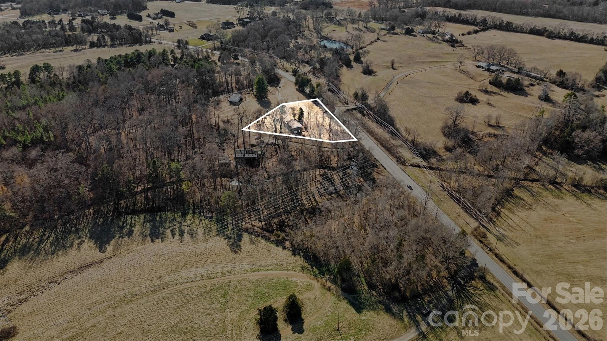 4650 Windy Road Concord, NC 28027 - Photo 20 of 34 an aerial view of a house with a yard