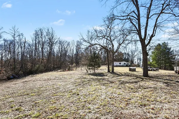 a view of a backyard of the house