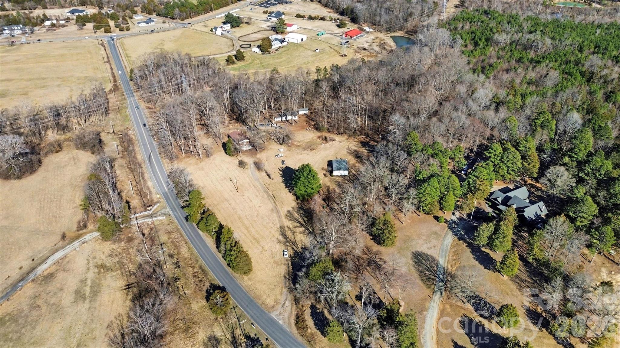 4650 Windy Road Concord, NC 28027 - Photo 32 of 34 a view of a dry yard with wooden fence