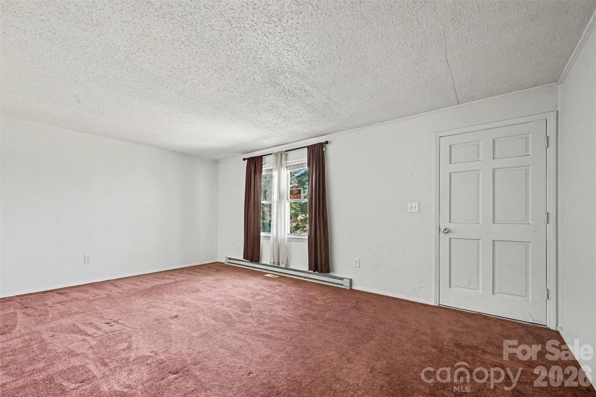 4650 Windy Road Concord, NC 28027 - Photo 6 of 34 a view of an empty room with a window