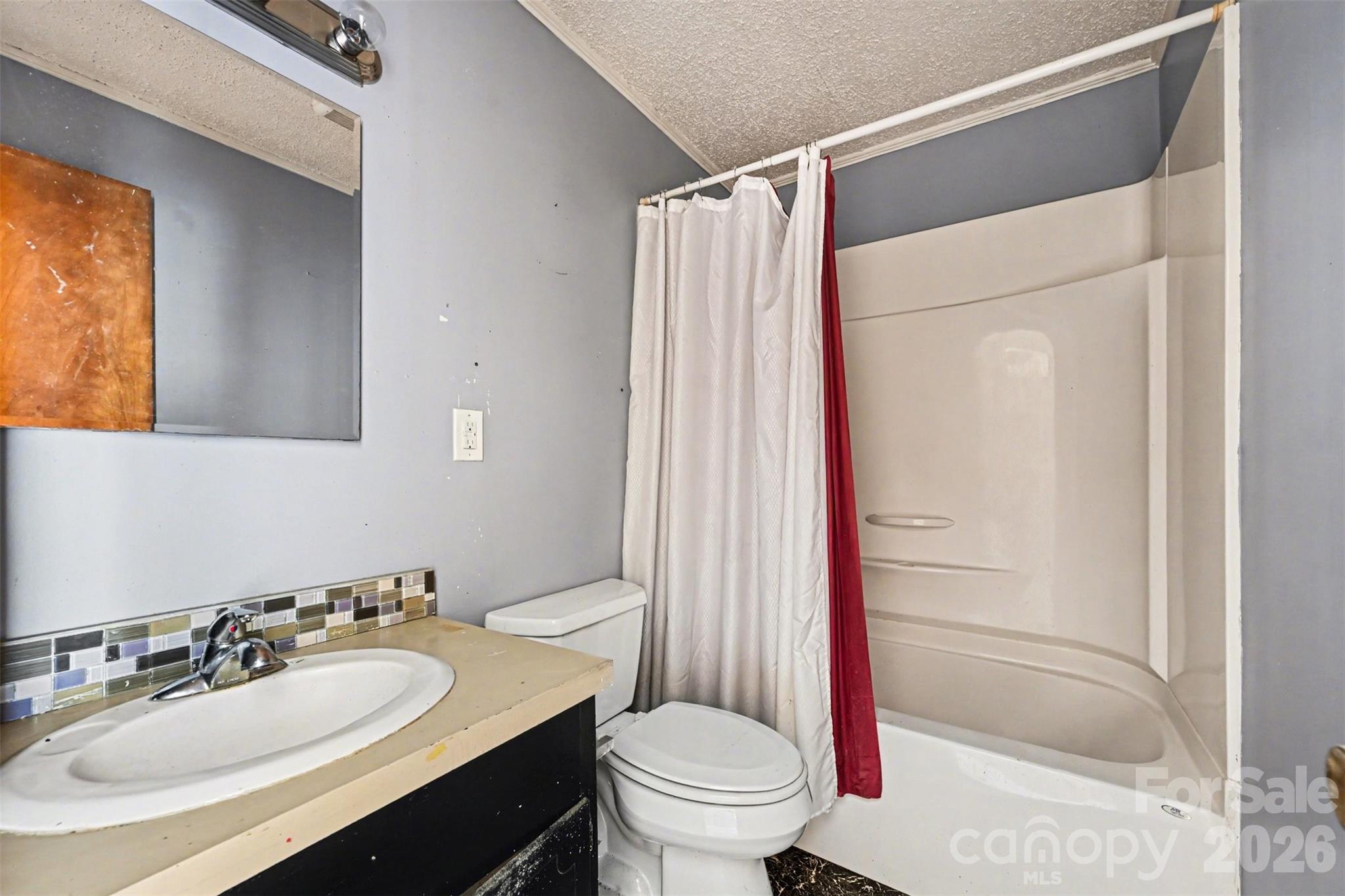 4650 Windy Road Concord, NC 28027 - Photo 9 of 34 a bathroom with a sink toilet and shower