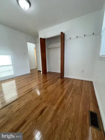 a bathroom with a toilet sink a shower and mirror