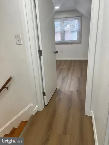 an empty room with wooden floor