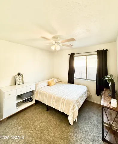 a bedroom with a bed and window