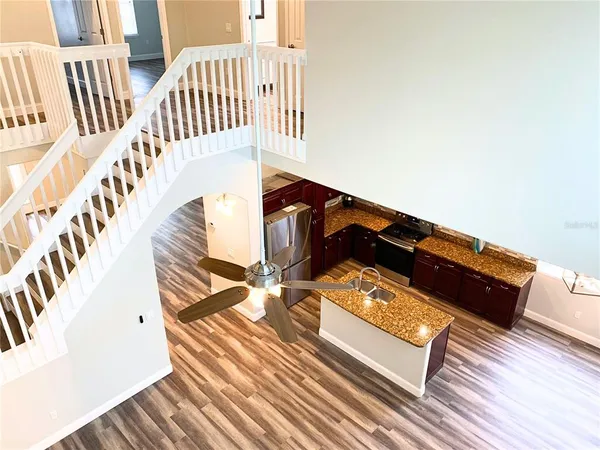 a view of staircase with white walls