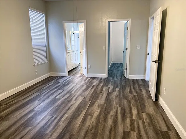 a view of wooden floor in an empty room