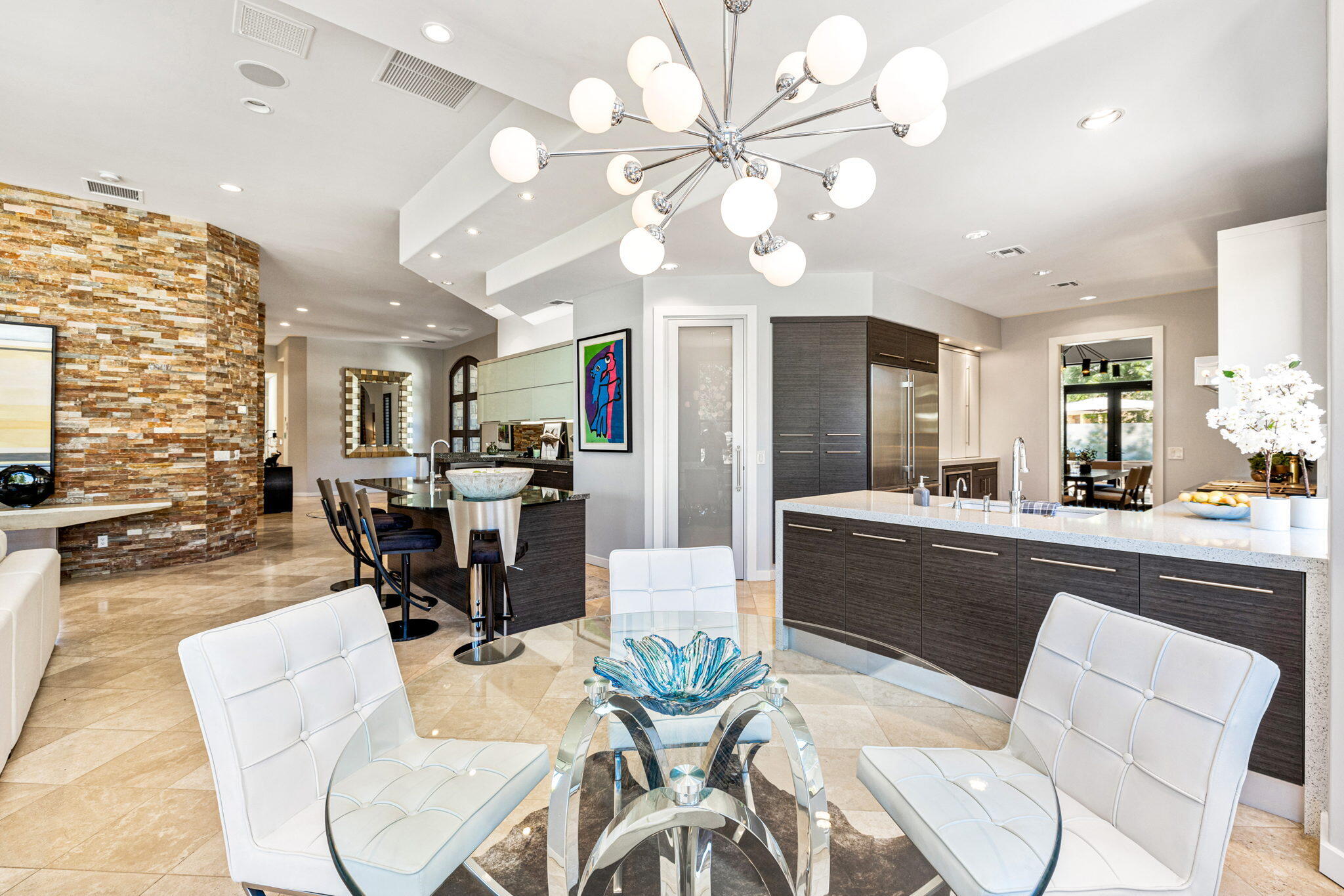 28 Clancy Lane South Rancho Mirage, CA 92270 - Photo 17 of 78 a view of a dining room with furniture and chandelier